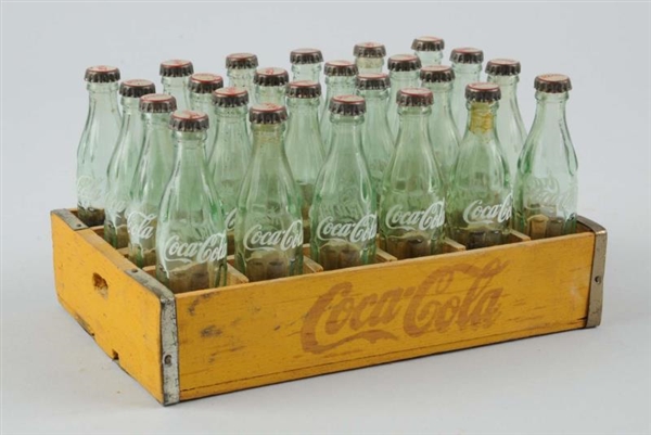 COCA-COLA MINIATURE CARRIER WITH BOTTLES.         