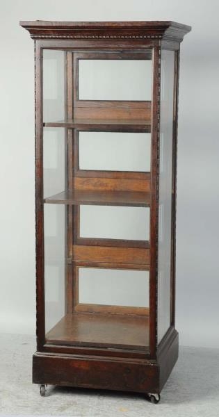 LARGE UPRIGHT WOODEN DISPLAY CASE.                