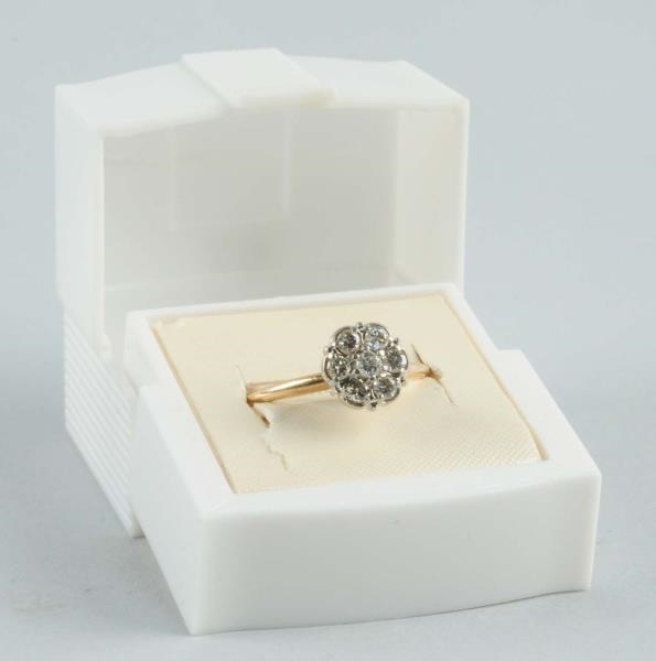 10K TWO-TONE ROUND BRILLIANT CUT FLOWER RING.     