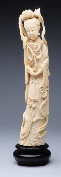 ORIENTAL IVORY STATUE OF WOMAN HOLDING FLOWERS.   