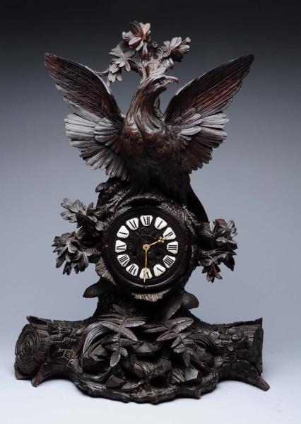 BLACK FOREST CARVED WOODEN CLOCK WITH EAGLE.      