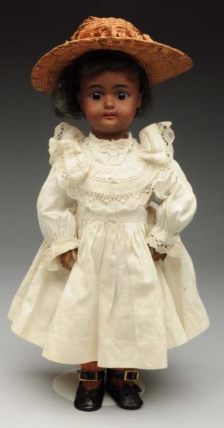 PETITE BROWN S & H CHILD DOLL.                    