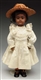 PETITE BROWN S & H CHILD DOLL.                    