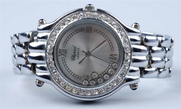 STAINLESS STEEL WATCH WITH CRYSTAL ACCENTS.       