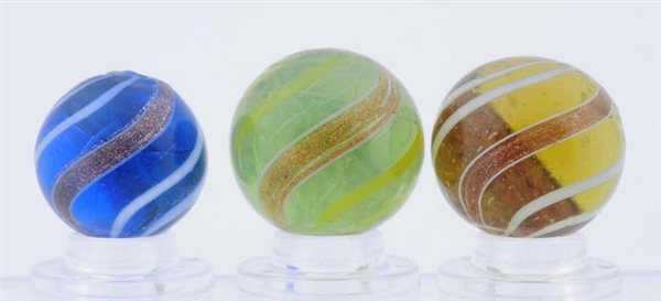 LOT OF 3: COLORED GLASS BANDED LUTZ MARBLES.      
