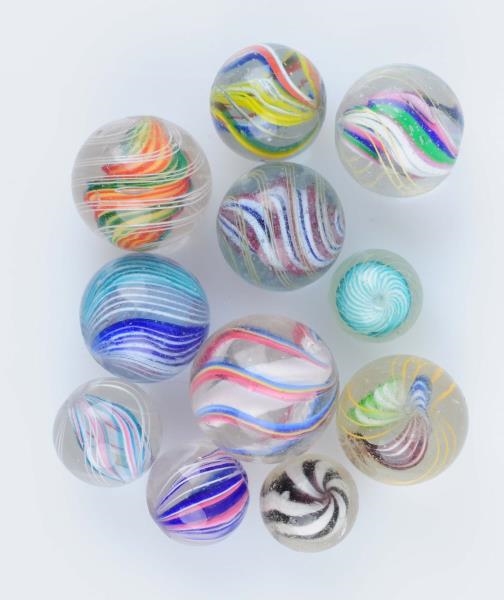 LOT OF 11: SWIRL MARBLES.                         
