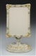 CAST IRON PAINT DECORATED EMBOSSED FRAME.         