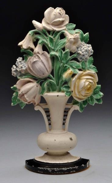 CAST IRON TULIPS AND ROSES FLOWER DOORSTOP.       