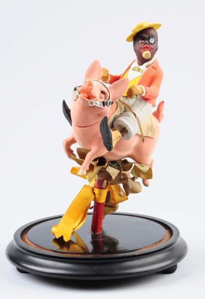 GERMAN COMPOSITION MAN RIDING PIG CANDY CONTAINER.