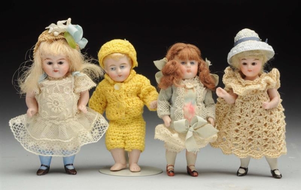 LOT OF 4: ALL-BISQUE DOLLS.                       