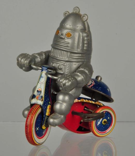 JAPANESE ROBOT ON TIN TRICYCLE TOY.               