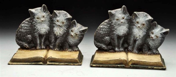 CAST IRON THREE KITTENS ON BOOK BOOKENDS.         
