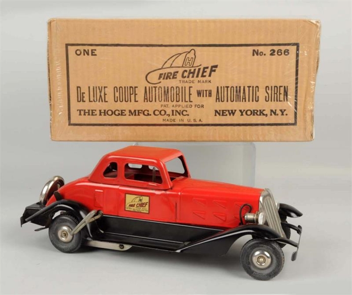 PRESSED STEEL WIND UP HOGE CHIEF COUPE.           