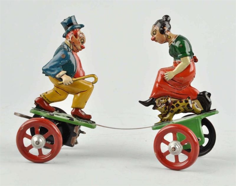 GERMAN NIFTY TIN LITHO WIND UP MAGGIE & JIGGS TOY.