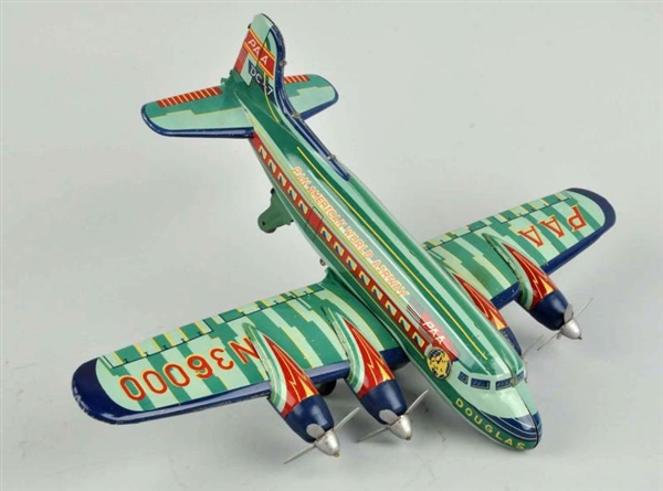 JAPANESE TIN LITHO FRICTION DOUGLAS DC 7 AIRPLANE.