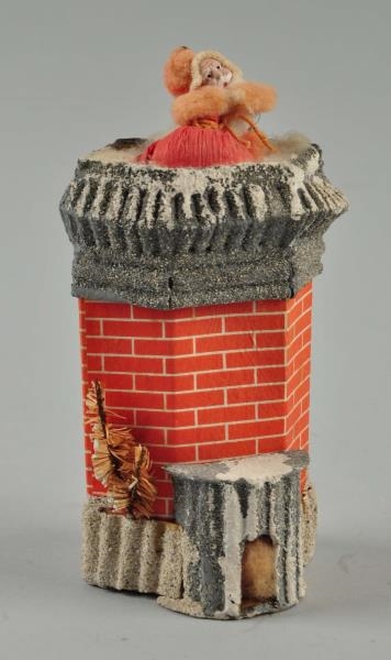 CARDBOARD SANTA IN CHIMNEY CANDY CONTAINER.       