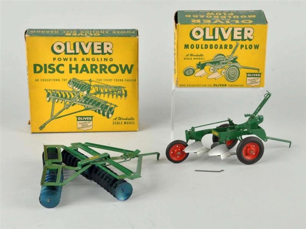TWO PRESSED STEEL OLIVER TOY TRACTOR ACCESSORIES. 