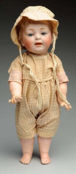 SMILING CHARACTER TODDLER DOLL.                   