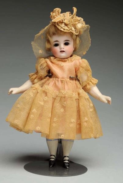 DAINTY ALL-BISQUE DOLL.                           