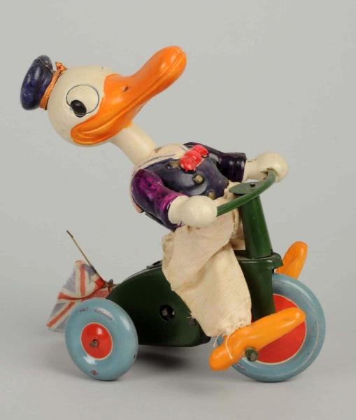 JAPANESE DISNEY CELLULOID DONALD TRICYCLE TOY.    