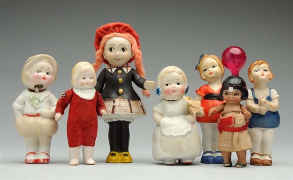 LOT OF 7: ALL-BISQUE DOLLS.                       