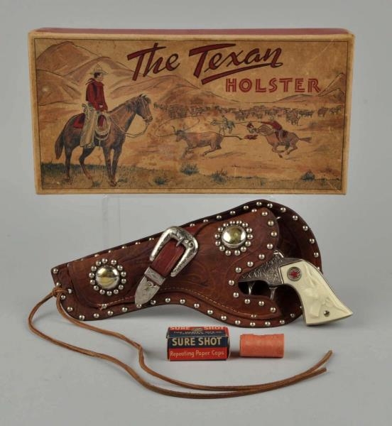 THE TEXAN GUN AND HOLSTER SET IN BOX.             