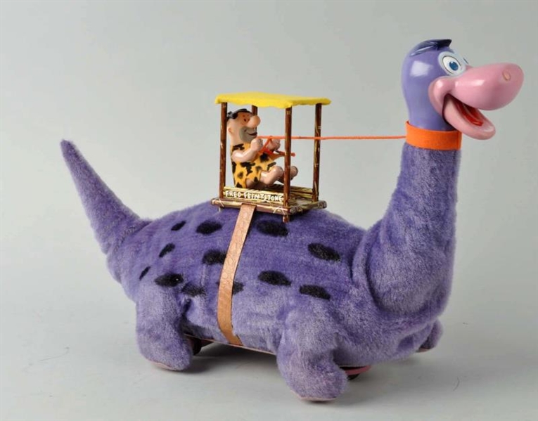 MARX BATTERY OPERATED FRED FLINSTONE ON DINO.     