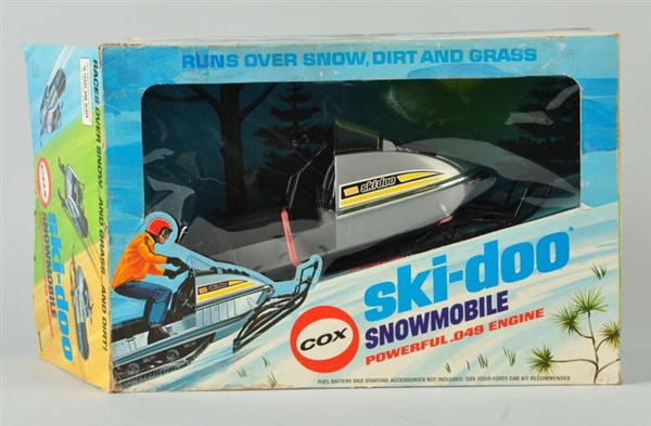 COX SKI-DOO GAS POWERED SNOWMOBILE IN BOX.        