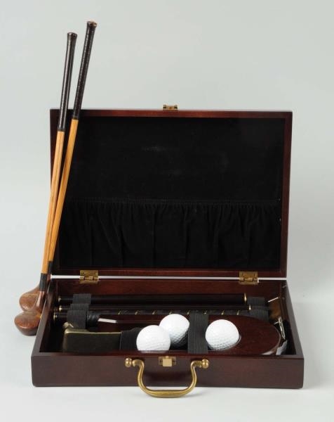 COMPACT WOODEN GOLF CLUB SET IN CASE.             