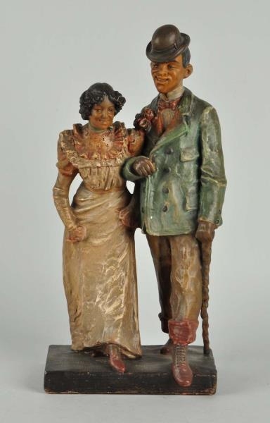 POTTERY STATUE OF BLACK AMERICAN COUPLE.          