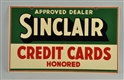 1941 SINCLAIR CREDIT CARDS TIN SIGN.              