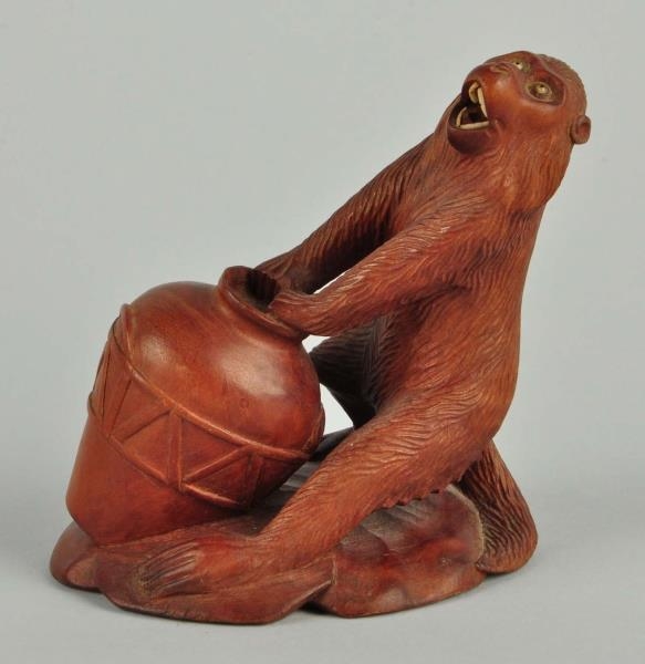 CARVED WOODEN FIGURE OF MONKEY                    
