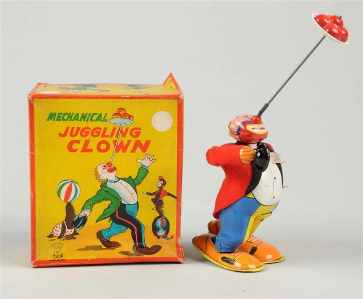 JAPANESE TIN LITHO WIND-UP TPS JUGGLING CLOWN.    