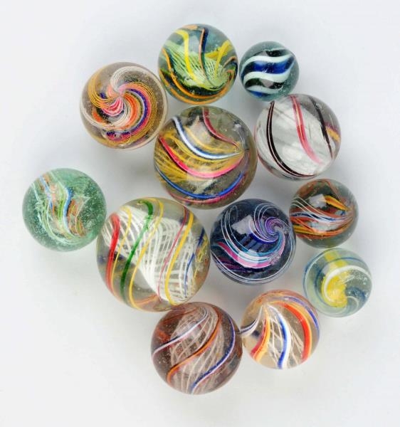 LOT OF 12: LARGE SWIRL MARBLES.                   
