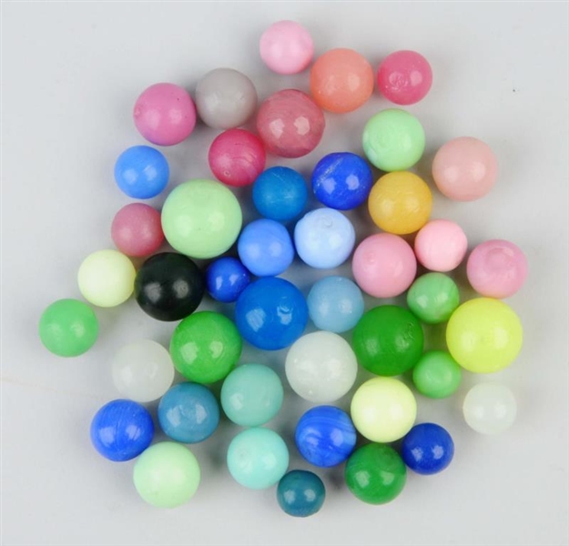 LOT OF APPROX 44 SOLID OPAQUE MELON BALL MARBLES. 