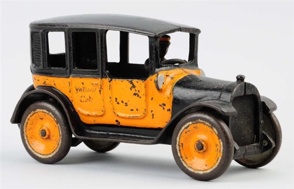 CAST IRON ARCADE YELLOW TAXI TOY.                 
