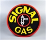 SIGNAL GAS WITH BLACK STOP LIGHT LOGO SIGN.       