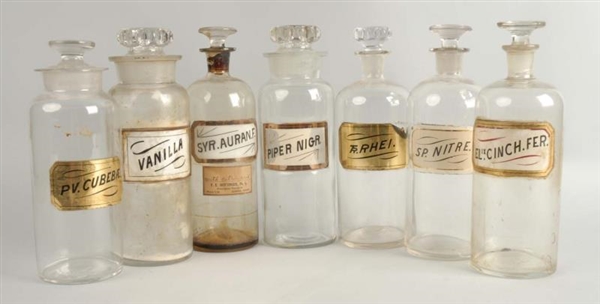 LOT OF 7: APOTHECARY JARS.                        