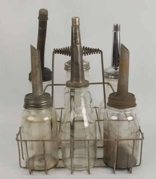 LOT OF 6: OIL BOTTLES WITH CARRIER.               