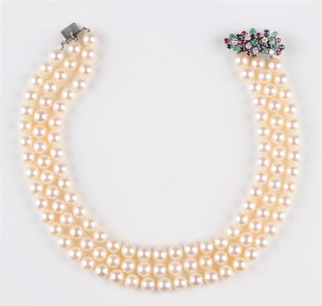 MULTI-GEM CLASP ON PEARL NECKLACE.                