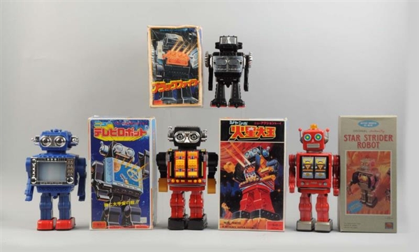 LOT OF 4: JAPANESE BATTERY OPERATED ROBOTS.       