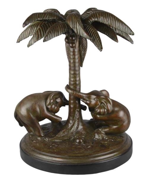 STATUE OF TWO ELEPHANTS AND A PALM TREE           