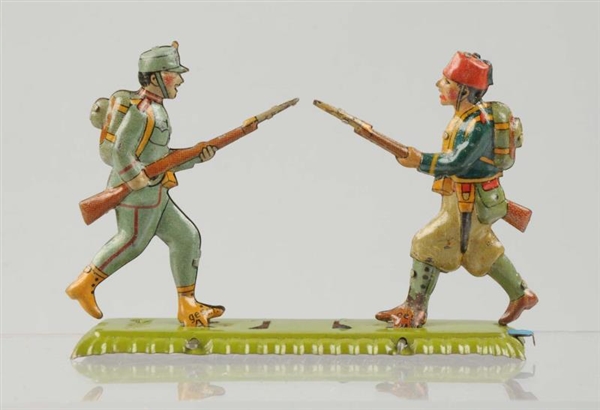 SCARCE GERMAN TIN LITHO SOLDIERS PENNY TOY.       