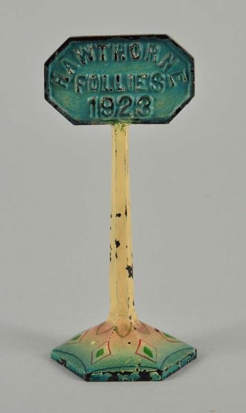 CAST IRON SIGN ADVERTISING PAPERWEIGHT.           