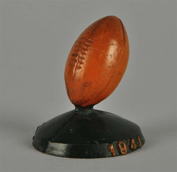 CAST IRON FOOTBALL ON BASE ADVERTISING PAPERWEIGHT