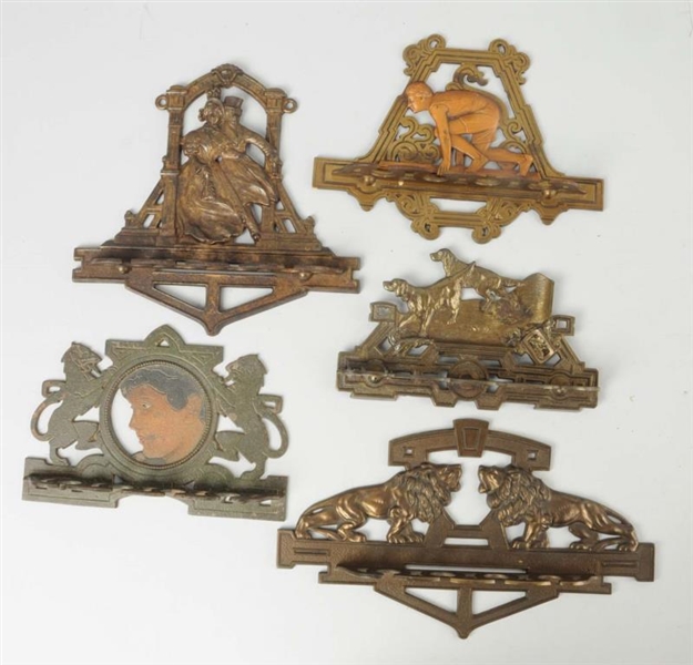 LOT OF 5: CAST IRON PIPE HOLDERS.                 