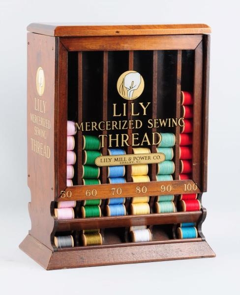 LILY SEWING THREAD SPOOL DISPLAY CABINET.         