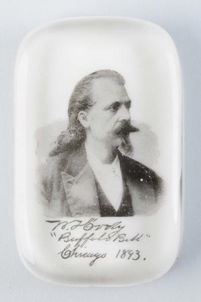 1893 BUFFALO BILL GLASS PAPER WEIGHT.             