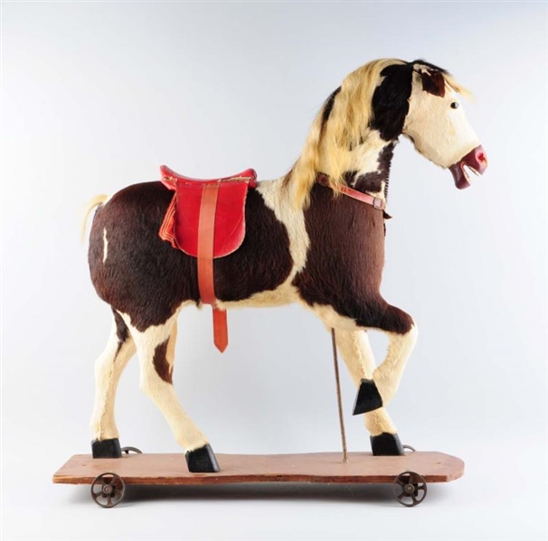PULL-TOY HORSE ON WHEELS.                         