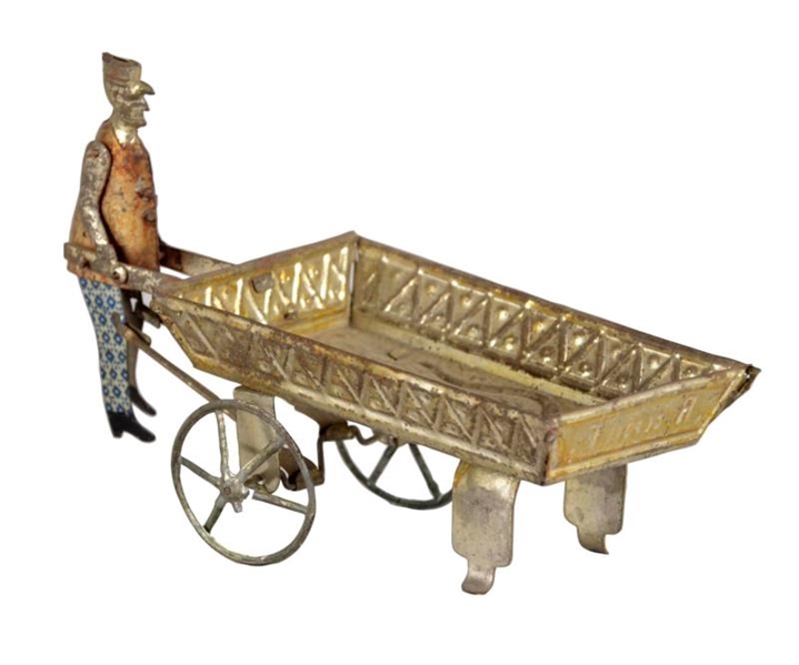 MAN WITH CART PRESSED TIN TOY                     